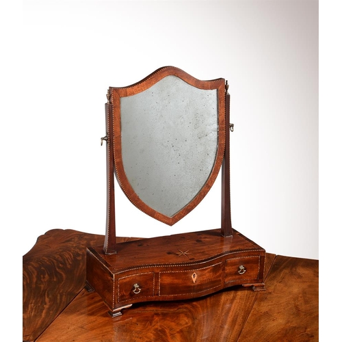 401 - A George III mahogany and inlaid dressing mirror, c.1780, the platform of serpentine outline and wit... 