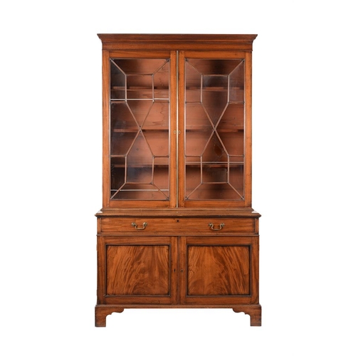 512 - A George III mahogany and glazed bookcase cabinet, c.1800, 128cm wide, 58.5cm deep, 229cm high

Prov... 