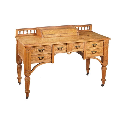 578 - An Aesthetic movement Karelian birch desk c.1890, 119cm wide, 60cm deep, 82cm high