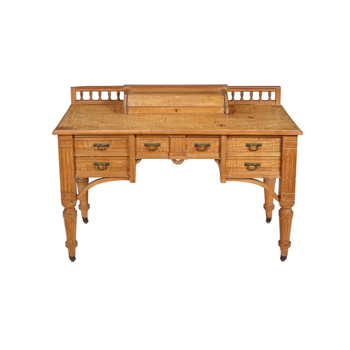 578 - An Aesthetic movement Karelian birch desk c.1890, 119cm wide, 60cm deep, 82cm high