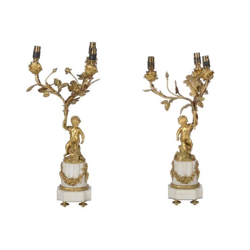 378 - A pair of French Ormolu and white marble three-light candelabras, in Louis XVI style, late 19th cent... 