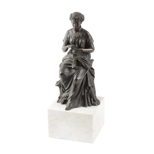 110 - A bronze model of a lady sewing a bell pull, late 19th century, atop a variegated white marble cuboi... 