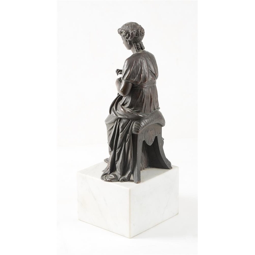 110 - A bronze model of a lady sewing a bell pull, late 19th century, atop a variegated white marble cuboi... 