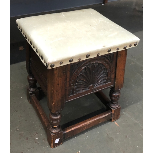 865 - A vinyl topped carved oak stool