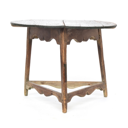 469 - A 19th century pine cricket table, circular two plank top with traces of original painted finish, on... 