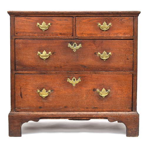 479 - A small George III and later oak chest of two short over two long drawers, on bracket feet, 80cm wid... 