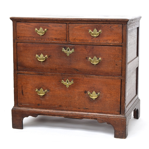 479 - A small George III and later oak chest of two short over two long drawers, on bracket feet, 80cm wid... 