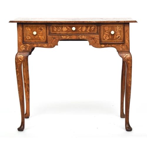 555 - An 18th century oak lowboy, all over floral marquetry, the moulded top over three frieze drawers, on... 