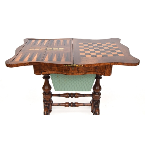 537 - A 19th century burr walnut and marquetry games and work table, the shaped foldover top opening to re... 