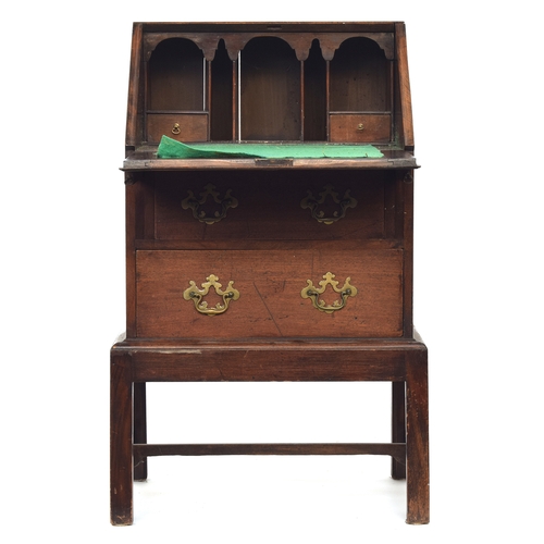 477 - An 18th century and later bureau, the fall front opening to a fitted interior, over two drawers, rai... 