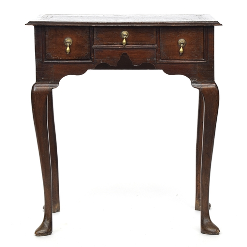 553 - A George I/II oak lowboy, moulded top over three drawers, raised on cabriole legs and pad feet, 69cm... 