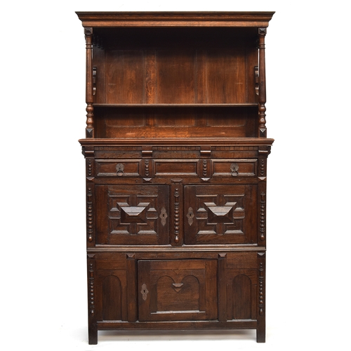 470 - An oak court cupboard, later top over a base with geometric mouldings, 117cm wide, 50cm deep, 206cm ... 