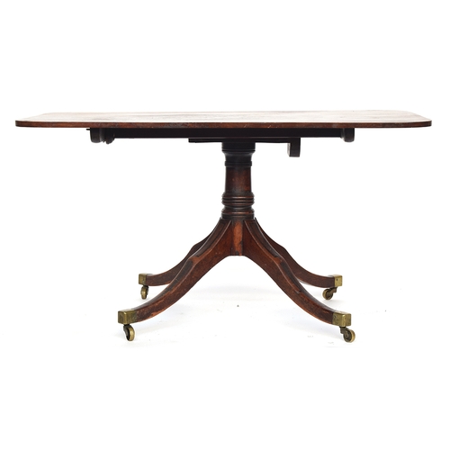 567 - A George III rectangular mahogany breakfast table, the rectangular tip top on a ring turned column, ... 