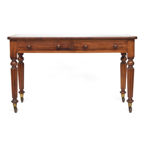 579 - A Victorian writing desk in the manner of Gillows, the gilt tooled green leather skiver over two fri... 