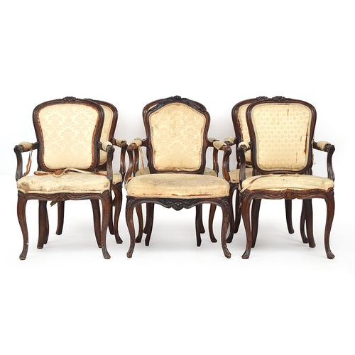 620 - A set of five Louis XV carved walnut open armchairs, upholstered backs above stuffover serpentine se... 