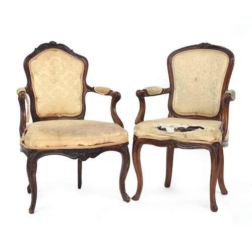 620 - A set of five Louis XV carved walnut open armchairs, upholstered backs above stuffover serpentine se... 