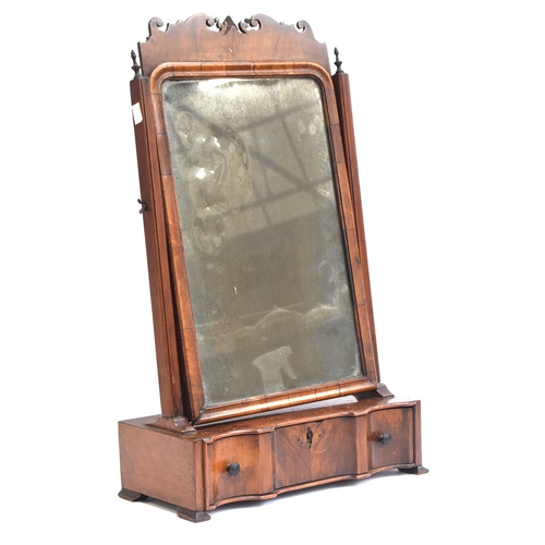 400 - An 18th century walnut box mirror, the original plate within a moulded frame, over a single shaped d... 