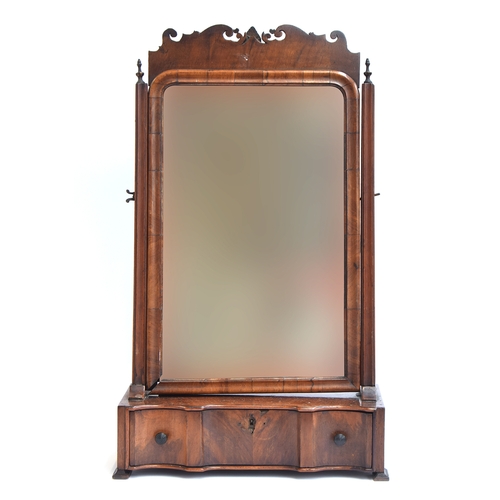 400 - An 18th century walnut box mirror, the original plate within a moulded frame, over a single shaped d... 