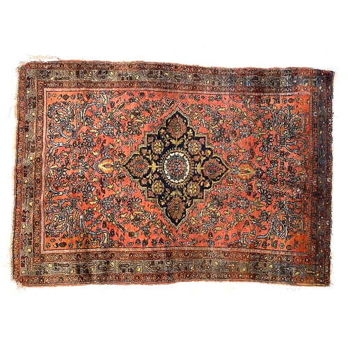 659 - A North West Persian Sarouk rug, with dark central medallion, 196x138cm