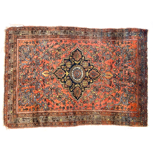 659 - A North West Persian Sarouk rug, with dark central medallion, 196x138cm