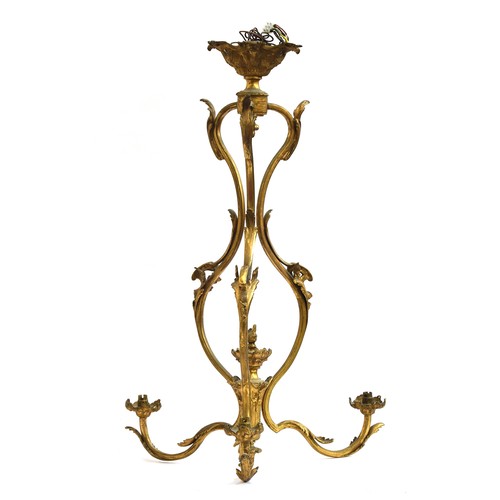 376 - A French gilt brass three arm ceiling light of scrolling foliate form, 74cm high