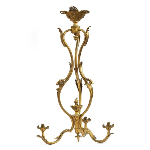 376 - A French gilt brass three arm ceiling light of scrolling foliate form, 74cm high