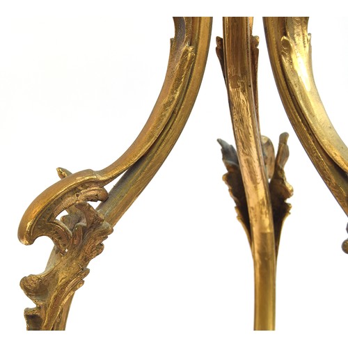 376 - A French gilt brass three arm ceiling light of scrolling foliate form, 74cm high