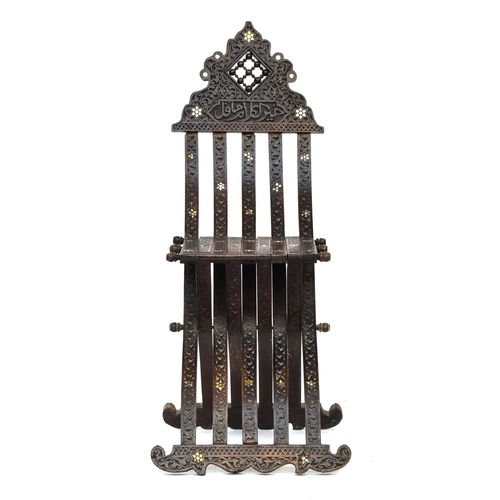 629 - A Syrian folding 'scribe' chair, allover carved with mother of pearl inlay and Arabic script