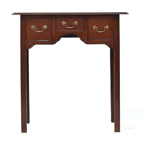 557 - A very small 18th century mahogany lowboy, the moulded top over three frieze drawers, raised on slen... 