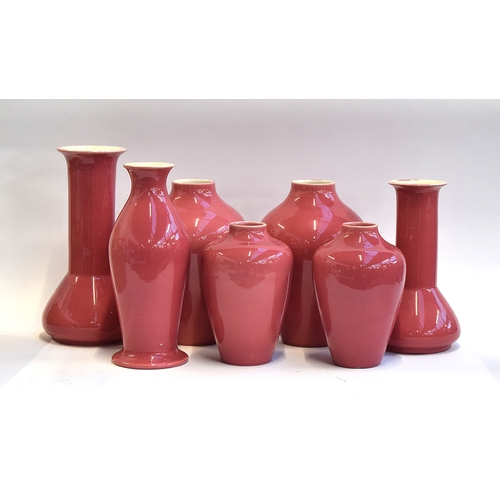 203 - Seven various Ault pottery pink glazed vases, 21.5cm to 32cm high