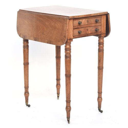 563 - A small Regency mahogany Pembroke table, two end drawers with opposing blind drawers, on delicate ri... 