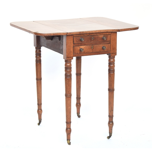 563 - A small Regency mahogany Pembroke table, two end drawers with opposing blind drawers, on delicate ri... 