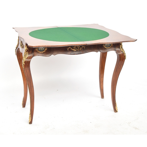 530 - A walnut and marquetry card table, the shaped foldover top with floral marquetry border, the frieze ... 