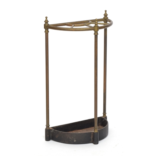 425 - A brass and cast iron demilune stick stand, 38cm wide, 65cm high