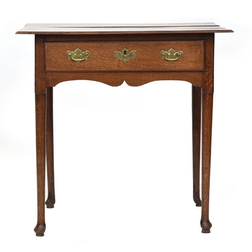 554 - A George II oak lowboy, three plank moulded top over single drawer, on tapering legs and pad feet, 7... 