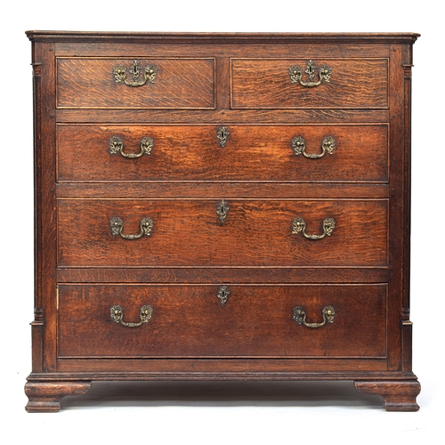 484 - A George III oak chest of drawers, the moulded top over two short and three graduating cockbeaded dr... 