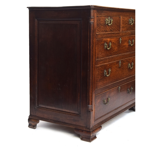 484 - A George III oak chest of drawers, the moulded top over two short and three graduating cockbeaded dr... 