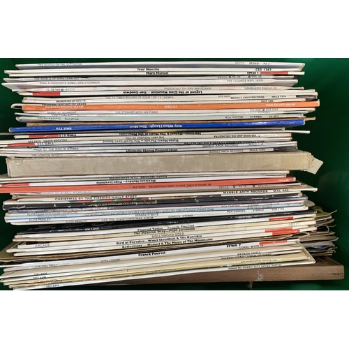 187 - A mixed box of vinyl LPs and singles to include Elvis Presley, etc