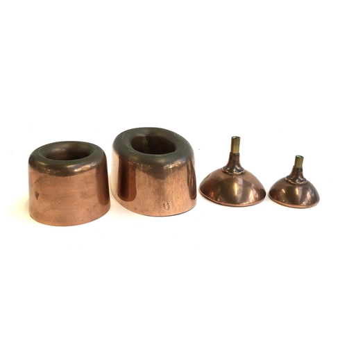 171 - Two Victorian copper jelly moulds, one marked A & N, CSL, together with two copper funnels