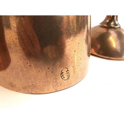 171 - Two Victorian copper jelly moulds, one marked A & N, CSL, together with two copper funnels