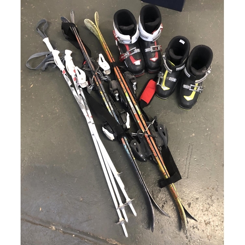 181 - Two pairs of children's skis and poles together with adjustable ski boots