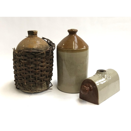 68 - A stoneware flagon, stamped a345 William Seymour & Co, Sherborne, in the remains of a wicker basket,... 