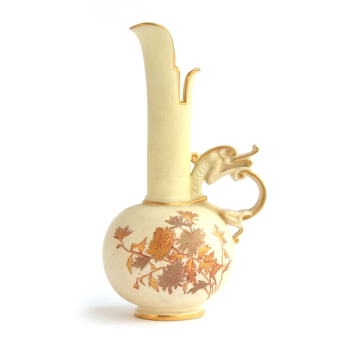 193 - An early 20th century Royal Worcester blush ivory Persian style ewer with dragon handle, heightened ... 