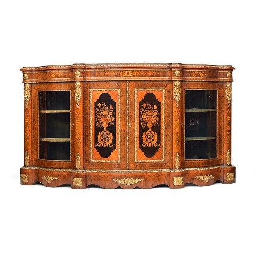 640 - A large Victorian gilt metal mounted walnut, kingwood and marquetry serpentine credenza, the moulded... 