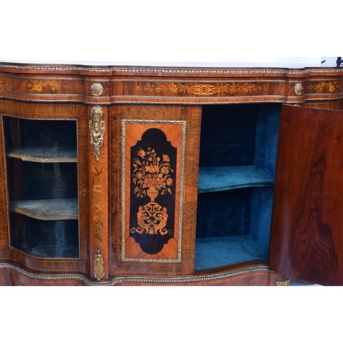 640 - A large Victorian gilt metal mounted walnut, kingwood and marquetry serpentine credenza, the moulded... 