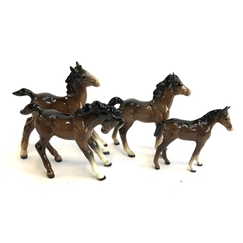 86 - A lot of four Beswick foals, two af, the tallest 13cmH (4)