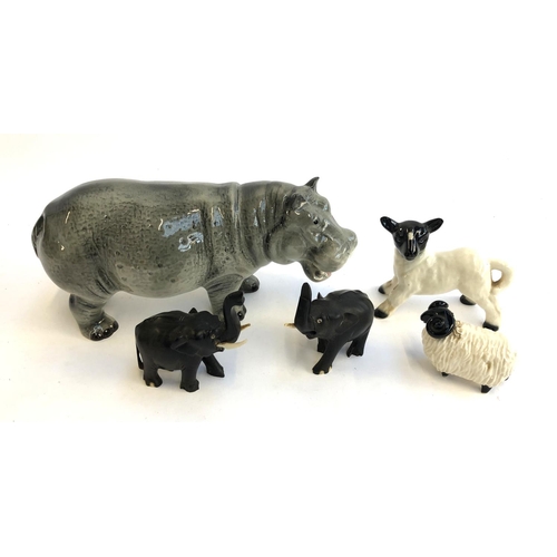 91 - A Melba hippo figurine, 20cmL; together with an unmarked sheep and lamb figurine; and two ebony elep... 