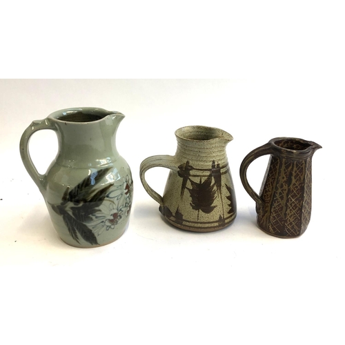 102 - Three Studio Pottery jugs with makers’ marks, the tallest 20cm high