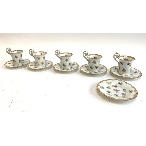 54 - A set of five continental hand painted porcelain coffee cups, 8cmH, and six saucers, 10.5cmD marked ... 