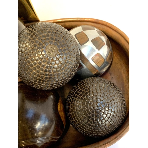 149 - A quantity of boules, to include some early French studded boules, together with a brass handled cop... 